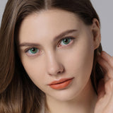 modelwearinghidrocor emerald green colored contacts