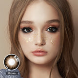 modelwearingglass ball chocolate brown colored contacts