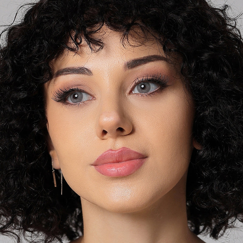 model wearing silver gray colored contacts