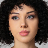 model wearing allure blue colored contacts