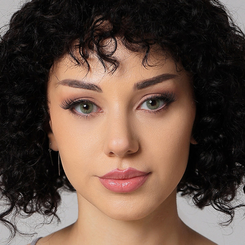 model wearing sage green colored contacts