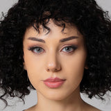 model wearing pearl gray colored contacts